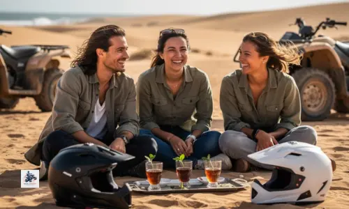 Touristes heureux partageant un thé après une excursion en quad à Essaouira dans les dunes