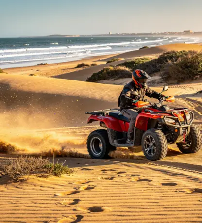 Location quad Essaouira dans les dunes, quad rouge en pleine action